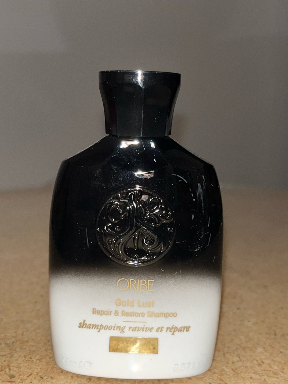 Oribe Gold Lust Repair & Restore Shampoo - Black and White with Gold Accents
